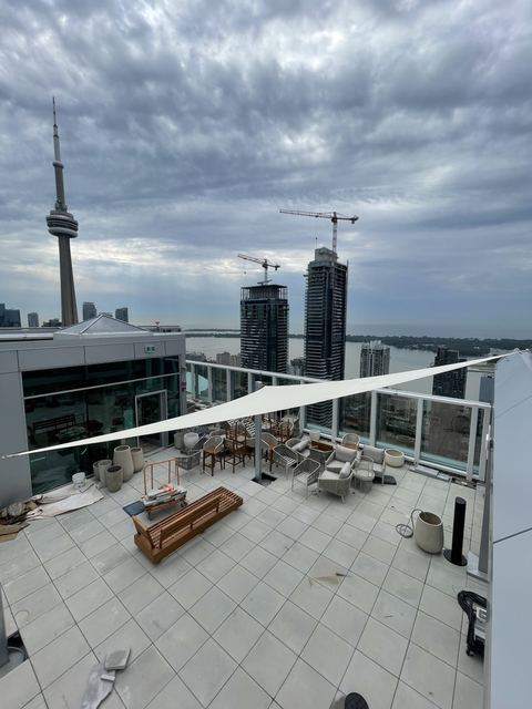 Shade sails at Aera with the CN Tower behind