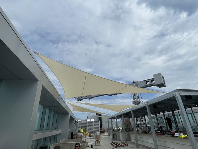 Overlapping shade sails along the Aera terrace
